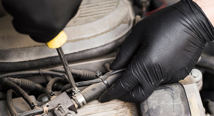 Black nitrile gloves in engine maintenance